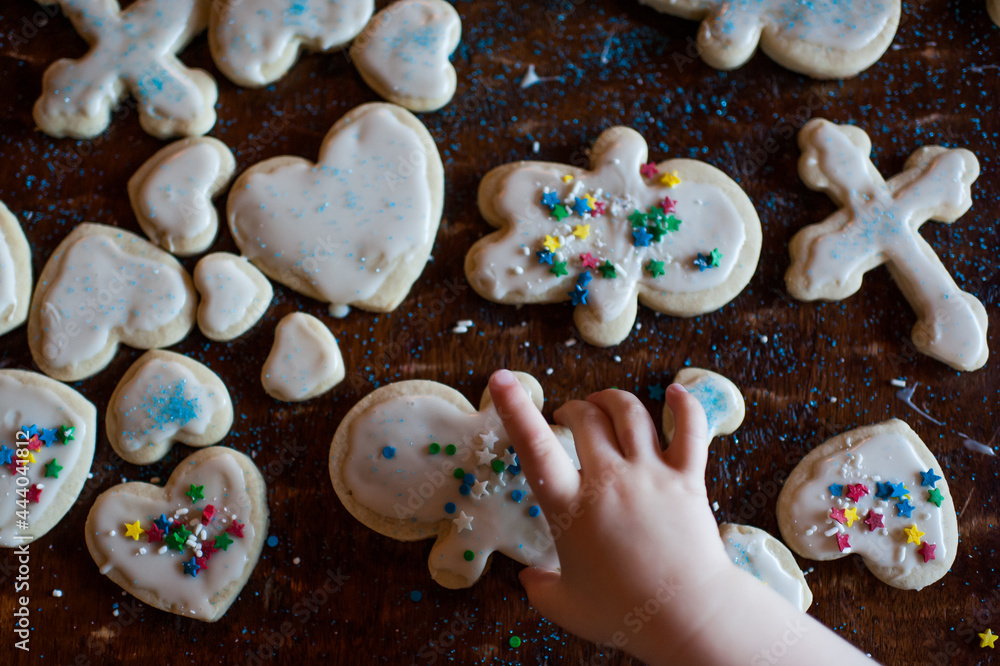 Child Holding Christmas Cookies Child Holding Christmas Cookies