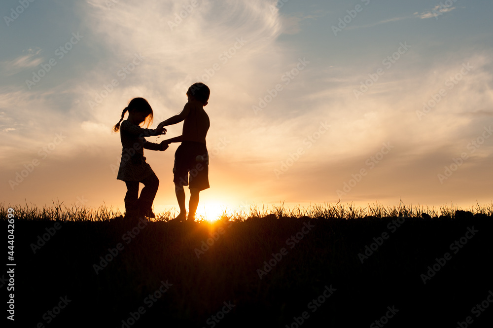 Kids Playing Together in Silhouette 