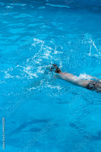 Jumping in pool, splashing water  © ivanaculafic