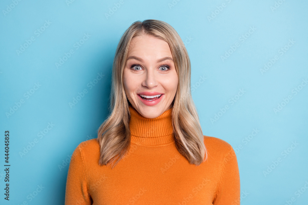 Photo of young happy positive blonde woman smile amazed good mood isolated on pastel blue color background Photo of young happy positive blonde woman smile amazed good mood isolated on pastel blue color background