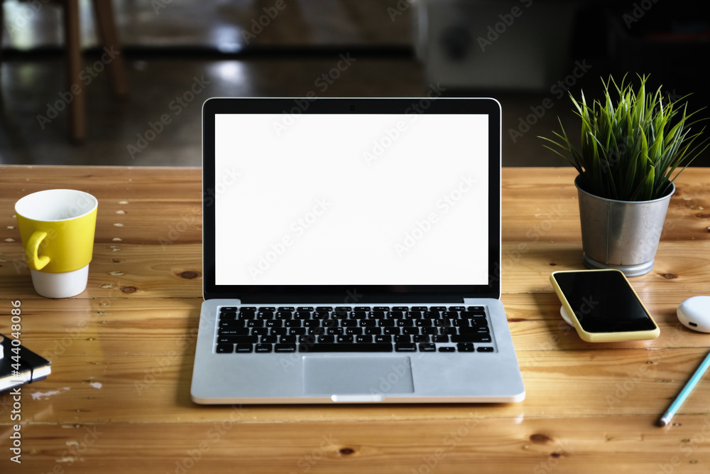 Close-Up laptop on wooden desk blur background. Laptop computer with blank screen and can be add your texts or others on Laptop. Close-Up laptop on wooden desk blur background. Laptop computer with blank screen and can be add your texts or others on Laptop.