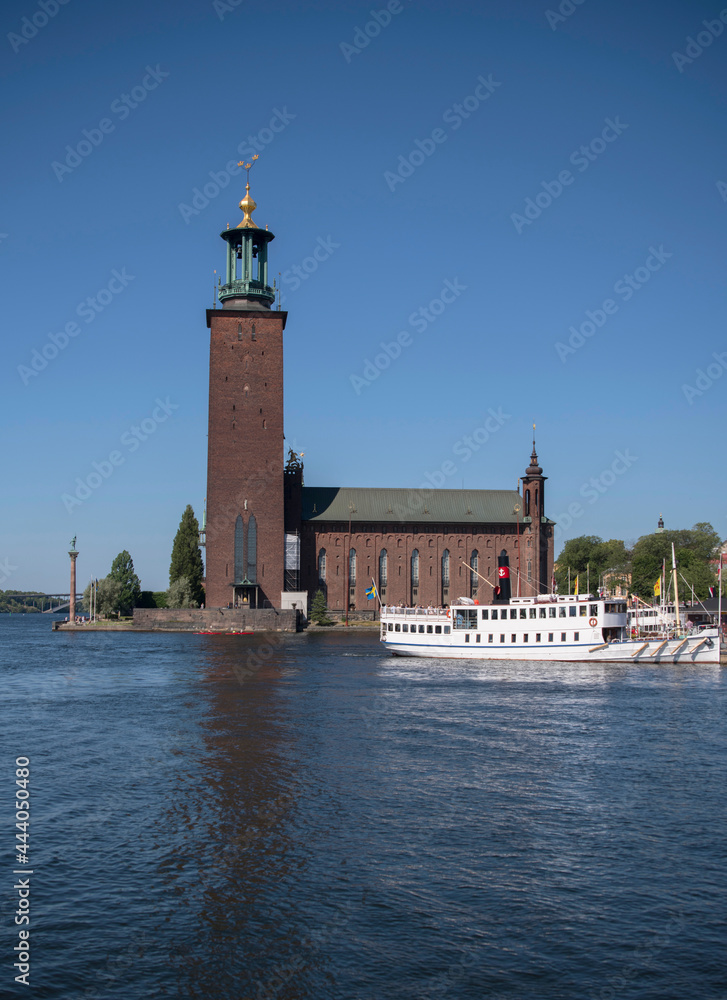 Old steam ship Prins Carl Philip leaving the pier at the Stockholm Town City Hall