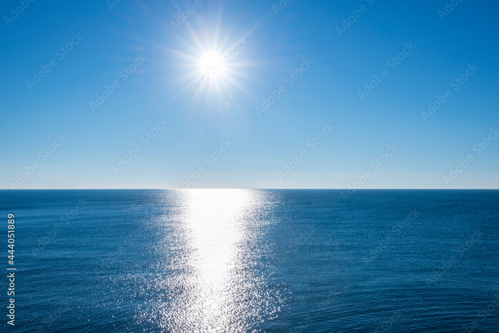 Sunbeam over Mediterranean Sea with Clear Blue Sky in Genoa, Liguria, Italy.