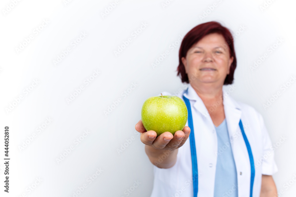 mature female doctor, healthy eating concept, isolated on white background.
mature female doctor, healthy eating concept, isolated on white background.