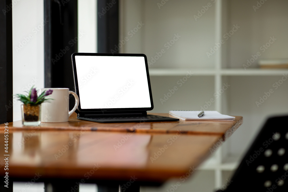 Workplace concept, Mockup blank screen tablet with blank white screen in office modern. Workplace concept, Mockup blank screen tablet with blank white screen in office modern.