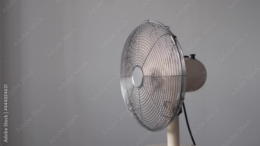 Air fan turning from side to side blowing wind. Electric fan cooling ...