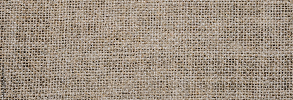 Rough hessian background with flecks of varying colors of beige and brown. with copy space. office desk concept, Hessian sackcloth burlap woven texture background. Rough hessian background with flecks of varying colors of beige and brown. with copy space. office desk concept, Hessian sackcloth burlap woven texture background.