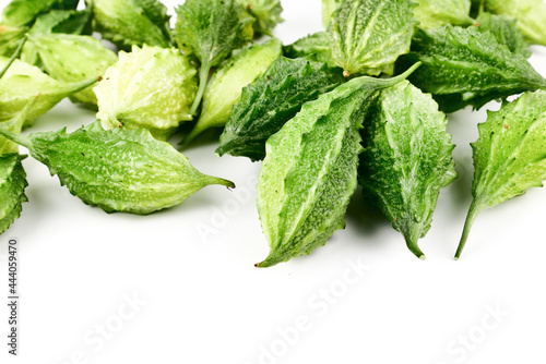 Balsam apple, Bitter cucumber, Bitter gourd, Balsam pear (momordica charantia) isolated on white background. photo