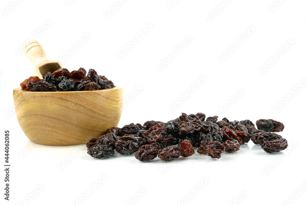 Fototapeta premium Black sweet Raisins or dried sweet grapes (kali kishmish or Zante currant) isolated on white background