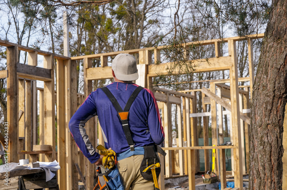 roofer ,carpenter working on roof structure at construction site roofer ,carpenter working on roof structure at construction site