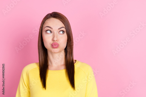 Photo portrait girl pouted lips sending air kiss on date looking copyspace isolated pastel pink color background
