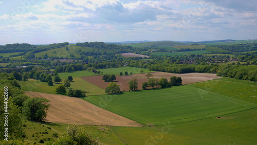 Wide angle view of the rolling fields of an english landsacpe with fields and trees