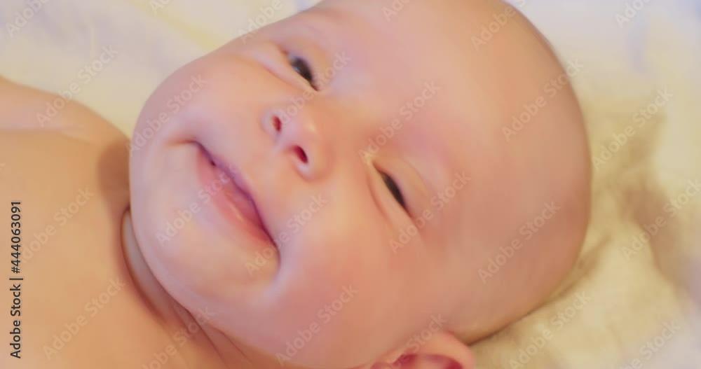 portrait of contemporary cute little curious newborn baby with attentive look.extreme close-up. portrait of contemporary cute little curious newborn baby with attentive look.extreme close-up.