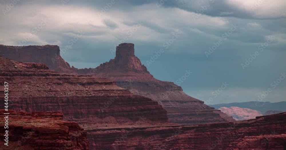 Time lapse of clouds behind towering red rock formations Time lapse of clouds behind towering red rock formations