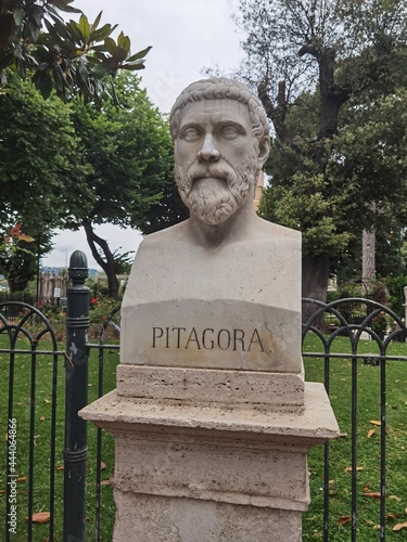 Rome, Italy - July 4, 2021: Marble bust of Pythagoras, Greek philosopher. The bust is publicly displayed in the gardens of the Pincio in Rome. The engraved name is visible under the bust. photo
