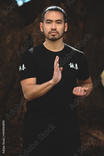chinese man practicing kung fu in the park