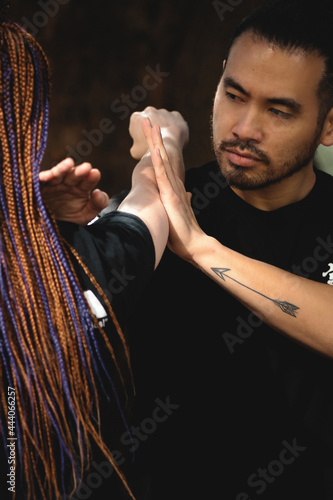 couple practicing kung fu in the park