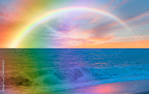 Beautiful landscape with turquoise sea with double sided rainbow at sunset © muratart