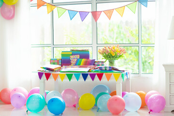 Presents at birthday party. Colorful wrapped gifts