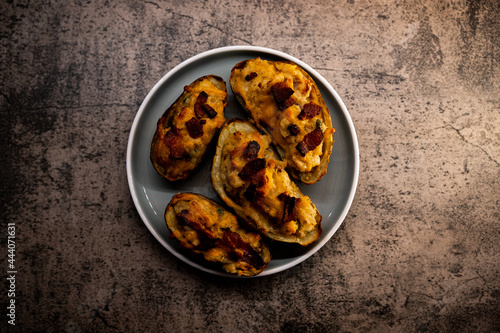 Top down view of Twice Baked potatoes with Bacon and chedder cheese photo