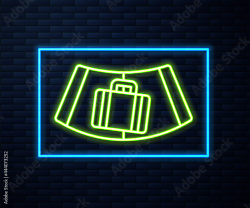 Glowing neon line Airport conveyor belt with passenger luggage, suitcase, bag, baggage icon isolated on brick wall background. Vector