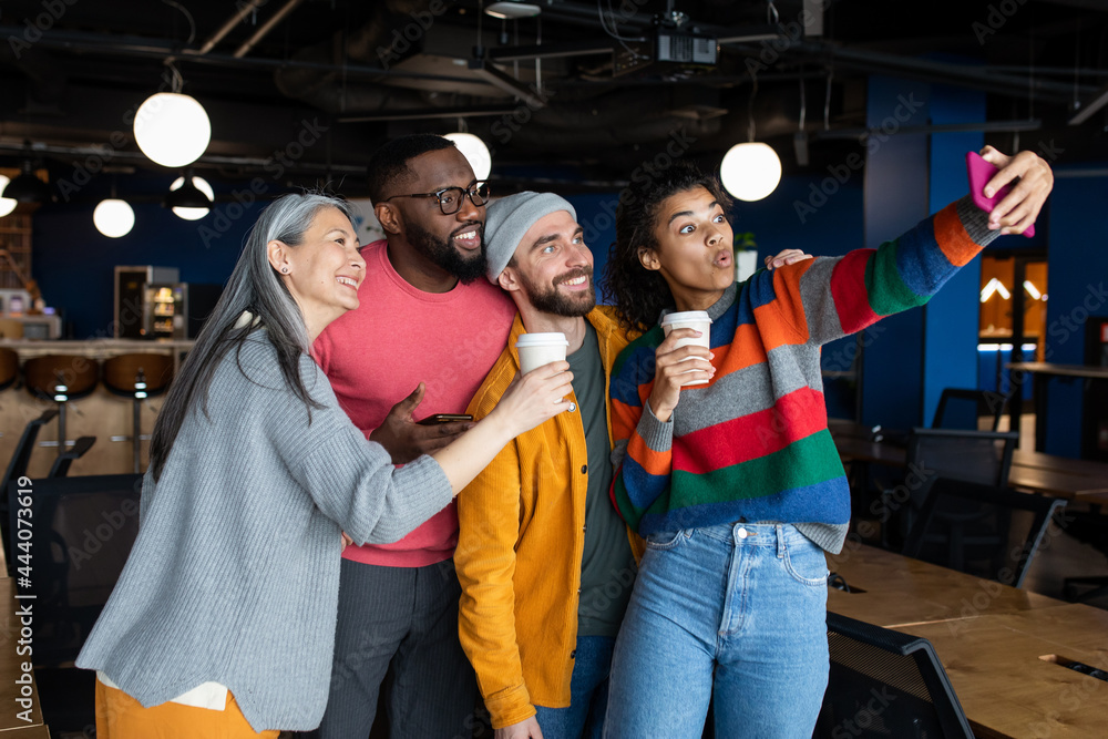 Group of diverse people taking selfie in office Group of diverse people taking selfie in office
