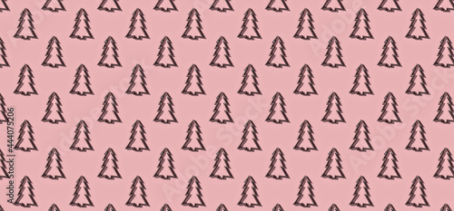 Pattern of christmas trees on pink pastel background