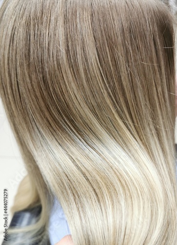 a girl with blond hair in a beauty salon.air-touch.hair coloring