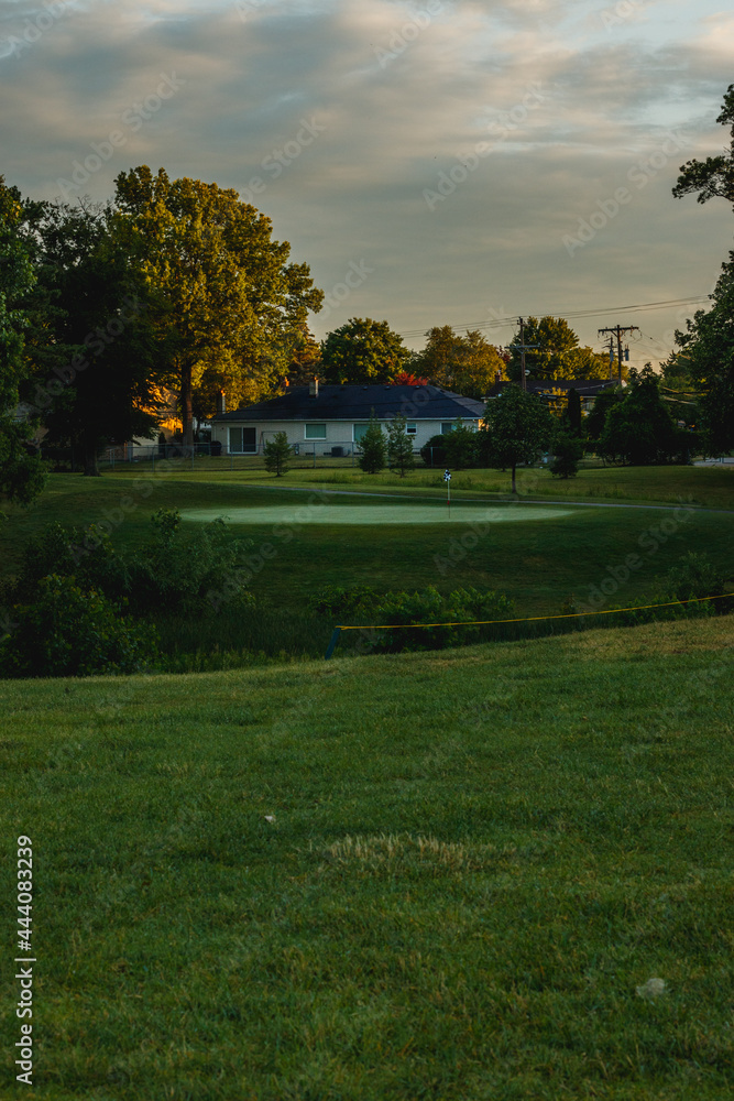 golf course on a sunny day looking at the golf holes golf course on a sunny day looking at the golf holes