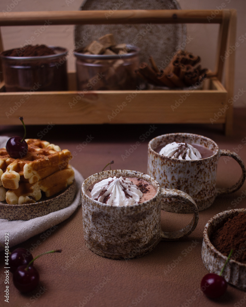 Fototapeta premium Hot chocolate and brownies on a beige background