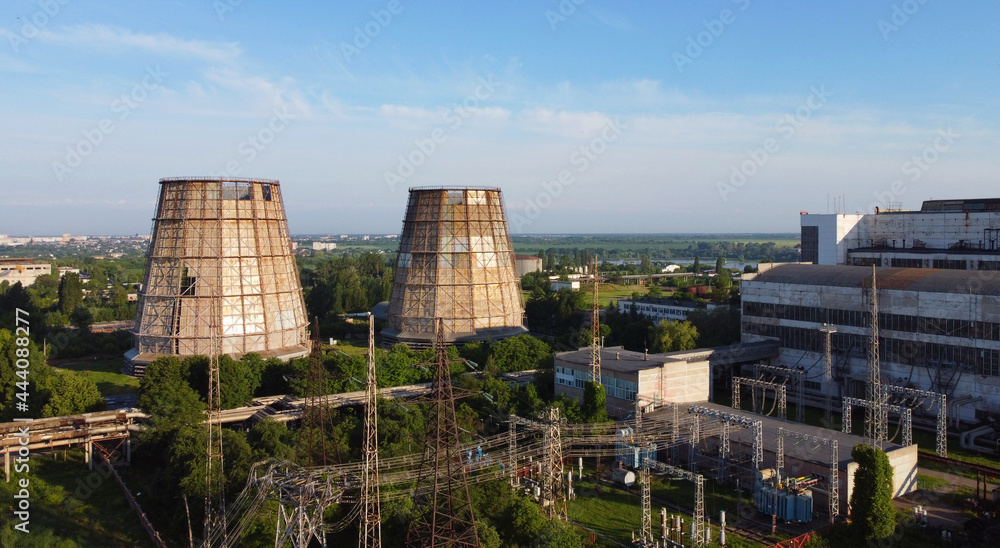 Aerial drone view flight near thermal power plant. Cooling towers of CHP