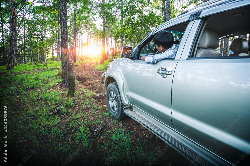 Man driving off-road travel on forest road, Beautiful nature sunset. Man driving off-road travel on forest road, Beautiful nature sunset.