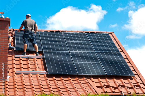 Installing solar panels on house roof