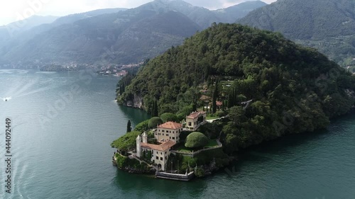 Aerial view of beautiful Villa del Balbianello is a mansion in the comune of Lenno province of Como and is famous for its elaborate terraced gardens at this moment a popular visit for tourists 4k photo