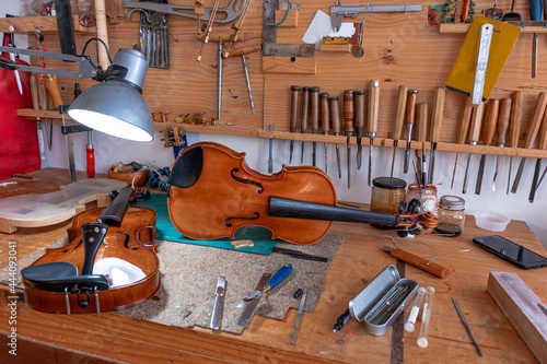 Violin that are repair in luthier workshop  photo