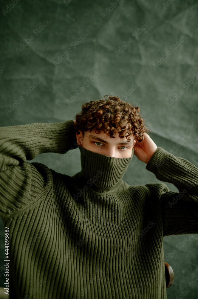 © Anna Artemenko/Stocksy - close-up portrait of a young curly guy © Anna Artemenko/Stocksy - close-up portrait of a young curly guy
