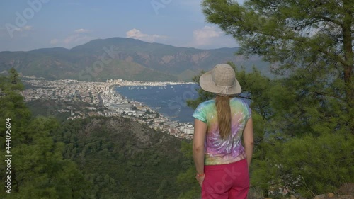 A person standing in front of a mountain