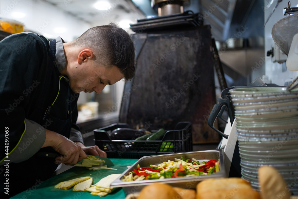 Chef Working In A Restaurant. Chef Working In A Restaurant.