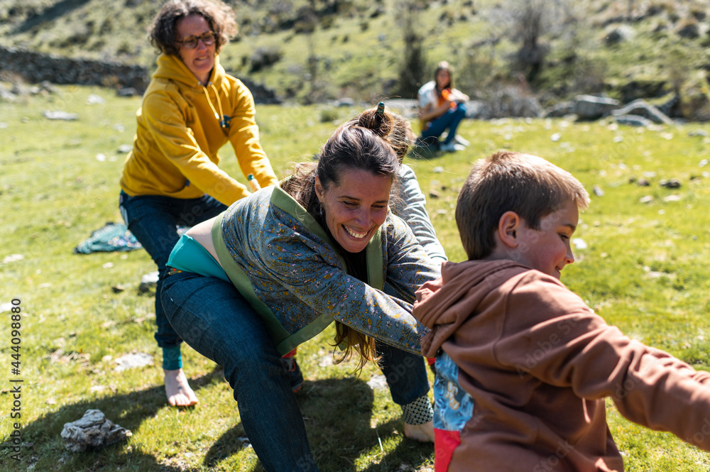 Family having fun playing childhood games outdoor Family having fun playing childhood games outdoor