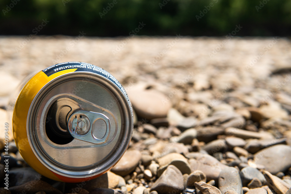 aluminum tin can lying on the beach aluminum tin can lying on the beach