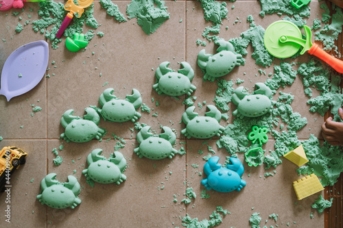 Asian boy playing kinetic sand photo