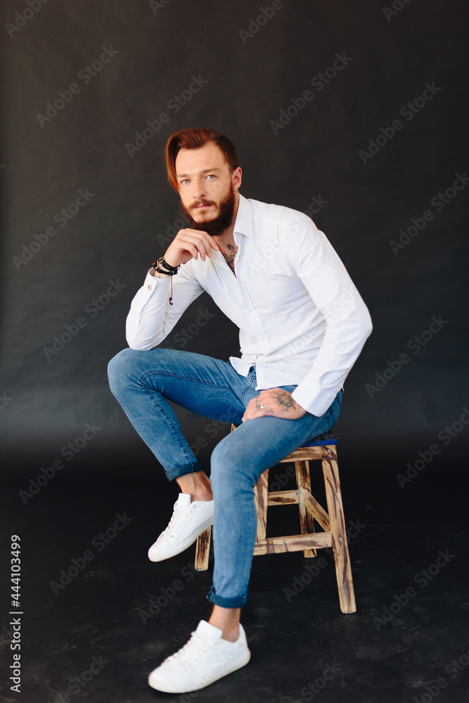 Studio photo of a beautiful young man with a beard Studio photo of a beautiful young man with a beard