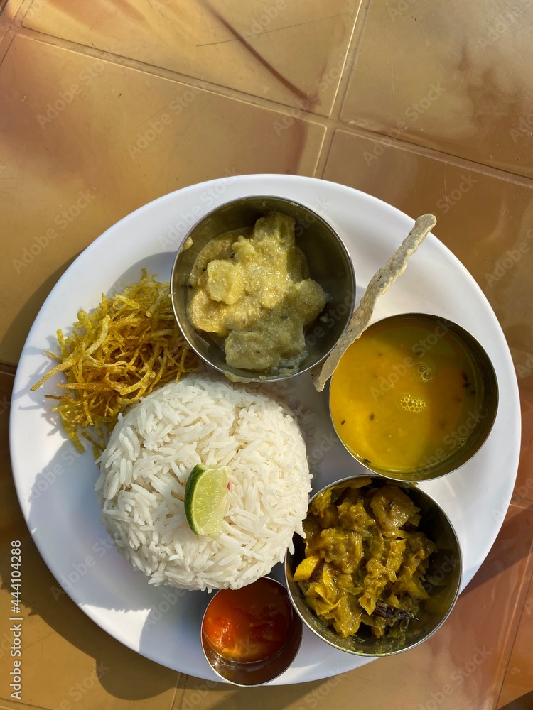 traditional-bengali-food-with-rice-dal-vegetables-etc-stock-photo