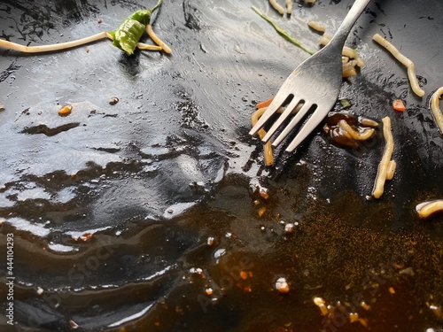 Empty plate after consuming chow-min in a restaurant