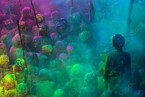 Indian People gathered in a temple,playing color powder