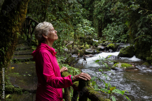 Elderly Woman hiking in Costa Rican Rainforest   photo