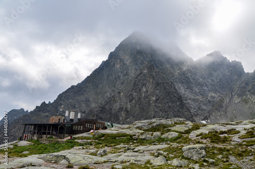 Mountain hut Teryho chata in the Little Cold Valley and peaks of the High Tatras mountains on background. Slovakia photo