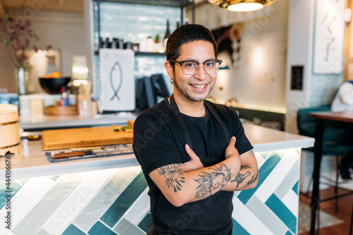 Latin waiter posing in a restaurant kitchen