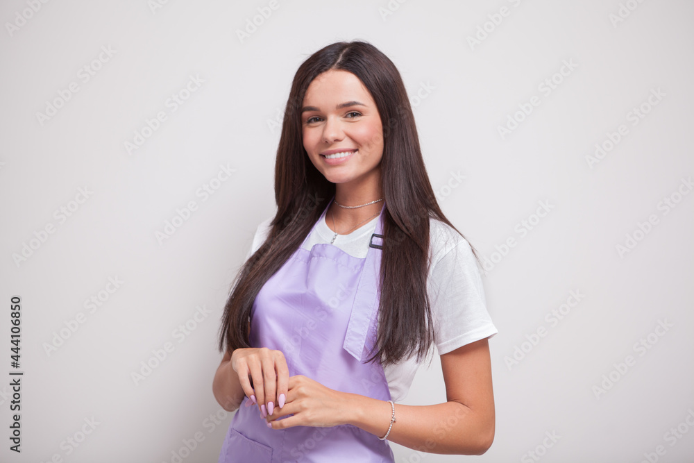 Beautiful happy woman wearing apron smiling to the camera Beautiful happy woman wearing apron smiling to the camera