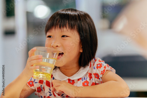 little girl drinking tea photo